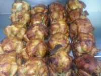 A tray of about 20 fresh BBQ chickens
